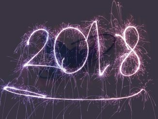 Fireworks spelling out 2018 superimposed over the Inspire bird logo