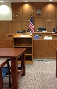 Empty courtroom with U.S. flag